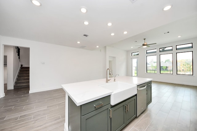 14647 Cedar Elm Ct, Willis, TX 77318 - kitchen featuring stainless steel dishwasher, open floor plan, a ceiling fan, a kitchen island with sink, and recessed lighting