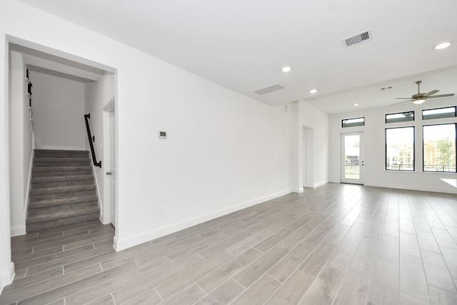 14647 Cedar Elm Ct, Willis, TX 77318 - unfurnished room featuring recessed lighting, a ceiling fan, light wood-style floors, and stairway