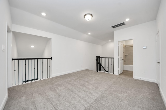 14647 Cedar Elm Ct, Willis, TX 77318 - carpeted empty room featuring vaulted ceiling and recessed lighting