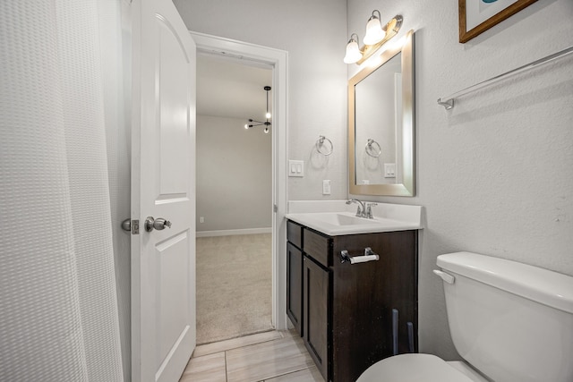 full bath featuring toilet and vanity