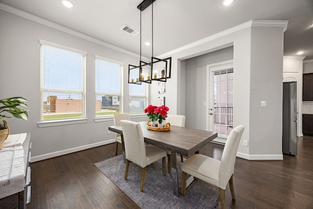 dining space with baseboards, visible vents, ornamental molding, and dark wood-style flooring