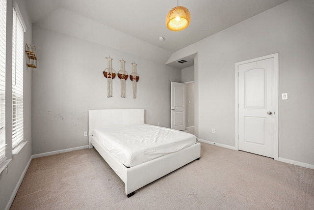 bedroom featuring carpet, baseboards, and lofted ceiling