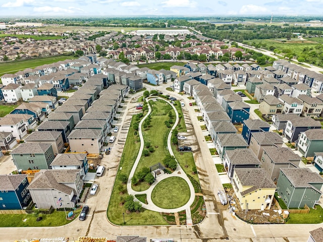 birds eye view of property with a residential view