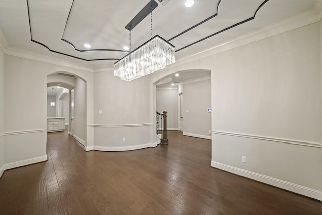 5730 Balcones Ridge Ln, Houston, TX 77059 - unfurnished dining area with crown molding, baseboards, wood finished floors, and arched walkways