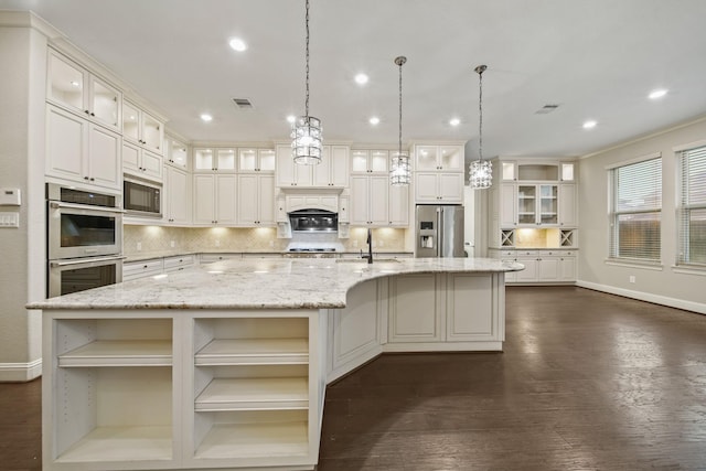 5730 Balcones Ridge Ln, Houston, TX 77059 - kitchen with a large island with sink, backsplash, open shelves, appliances with stainless steel finishes, and visible vents