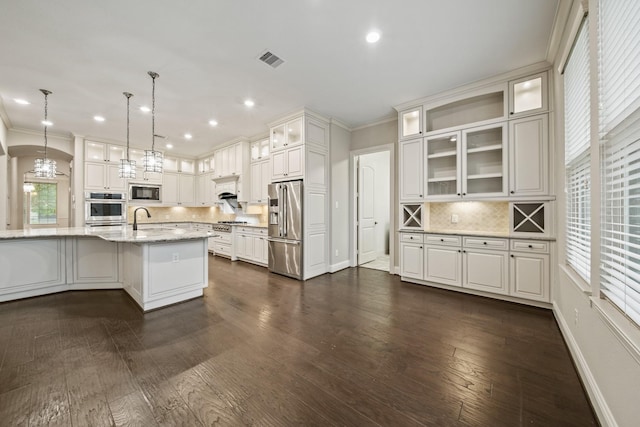 5730 Balcones Ridge Ln, Houston, TX 77059 - kitchen featuring a sink, ornamental molding, visible vents, and appliances with stainless steel finishes