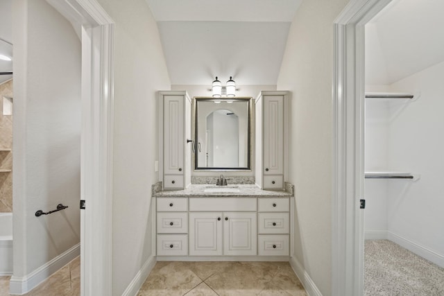 5730 Balcones Ridge Ln, Houston, TX 77059 - full bath featuring baseboards, a tub, tile patterned floors, and vanity