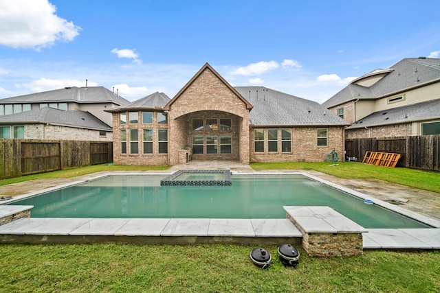 5730 Balcones Ridge Ln, Houston, TX 77059 - view of swimming pool with a fenced backyard, a pool with connected hot tub, and a yard