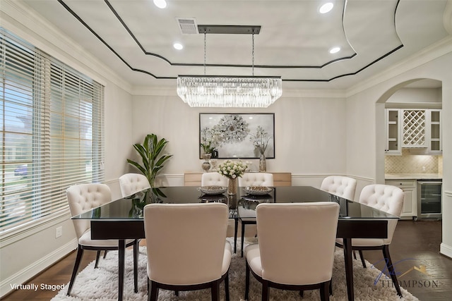 5730 Balcones Ridge Ln, Houston, TX 77059 - dining space with a healthy amount of sunlight, crown molding, and wine cooler