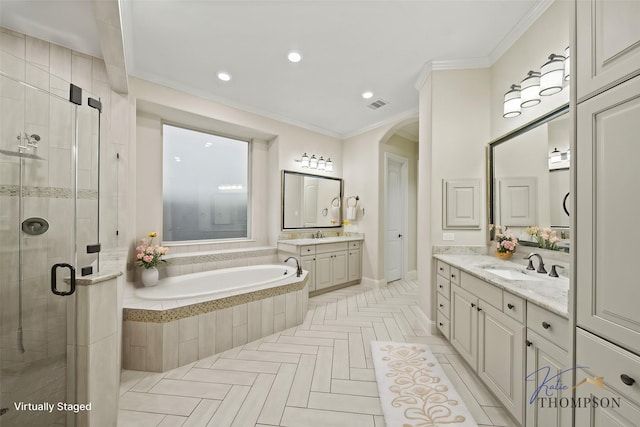 5730 Balcones Ridge Ln, Houston, TX 77059 - bathroom featuring a stall shower, a sink, a garden tub, visible vents, and ornamental molding