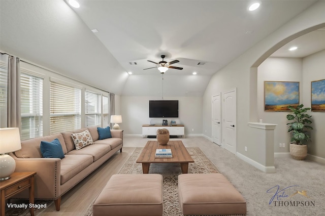 5730 Balcones Ridge Ln, Houston, TX 77059 - living room featuring a ceiling fan, lofted ceiling, baseboards, visible vents, and arched walkways