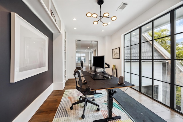 3835 Olympia Dr, Houston, TX 77019 - office area featuring wood finished floors, recessed lighting, a chandelier, and baseboards