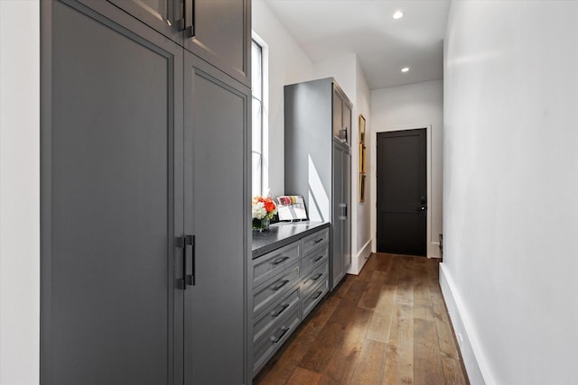 3835 Olympia Dr, Houston, TX 77019 - hall with dark wood-style flooring, baseboards, and recessed lighting