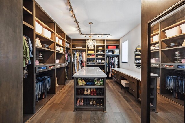 3835 Olympia Dr, Houston, TX 77019 - walk in closet featuring dark wood finished floors