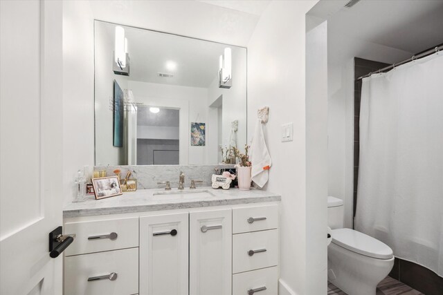 3835 Olympia Dr, Houston, TX 77019 - full bath with toilet, vanity, and a shower with shower curtain