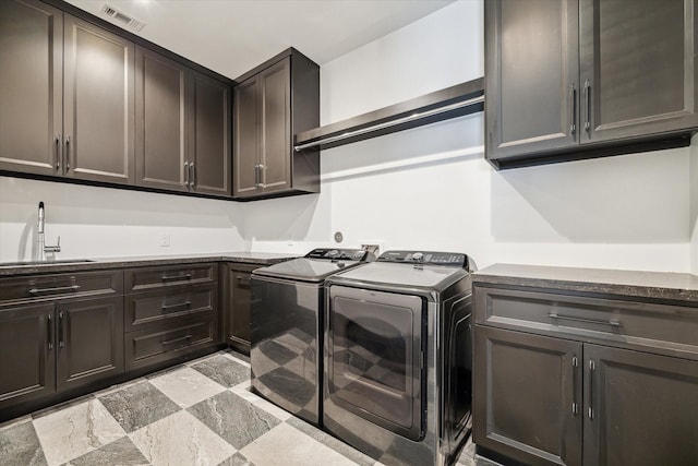 3835 Olympia Dr, Houston, TX 77019 - laundry room featuring cabinet space and separate washer and dryer
