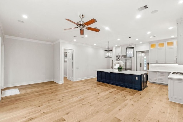 1024 Waverly St, Houston, TX 77008 - kitchen featuring built in refrigerator, ceiling fan, light countertops, a center island, and backsplash