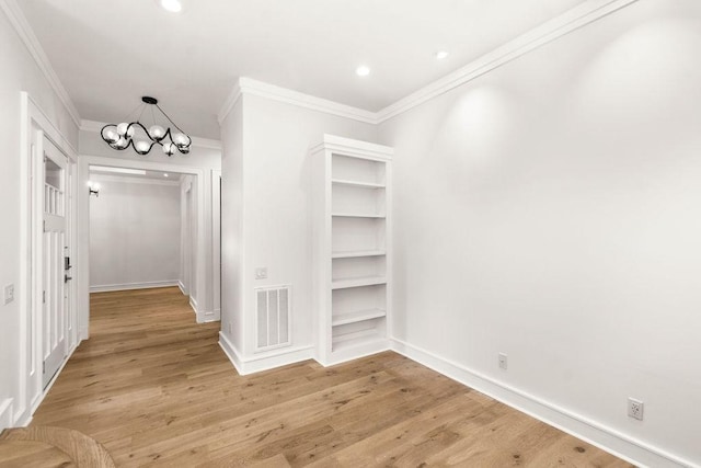 1024 Waverly St, Houston, TX 77008 - walk in closet with a chandelier and light wood finished floors