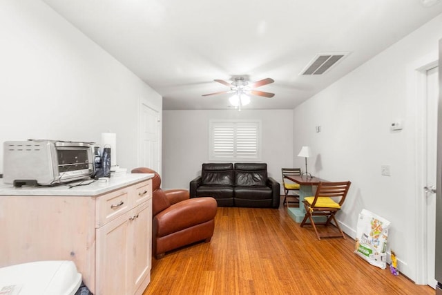 1024 Waverly St, Houston, TX 77008 - living area featuring light wood-type flooring and ceiling fan