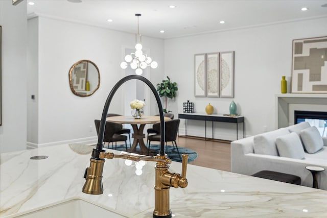 living room featuring wood finished floors, baseboards, and recessed lighting