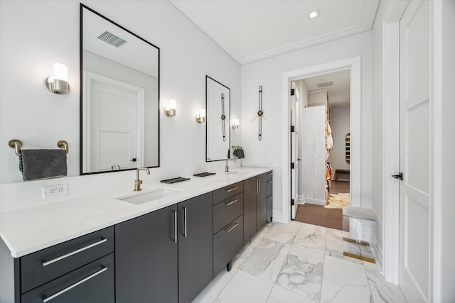 full bathroom with double vanity, visible vents, marble finish floor, and a sink