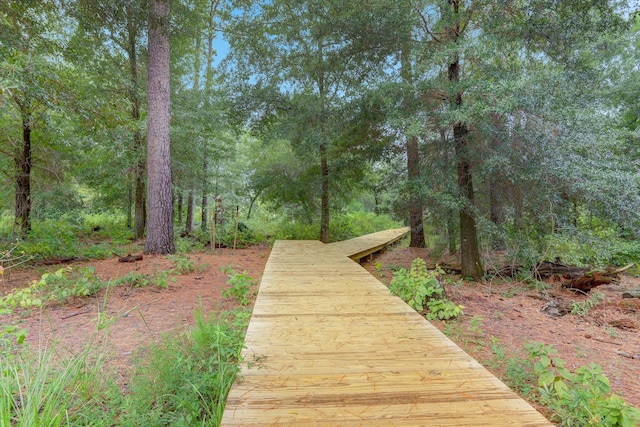 view of property's community with a forest view