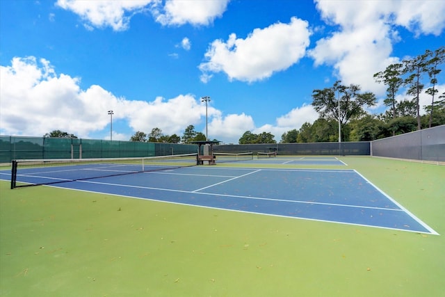 view of sport court with fence