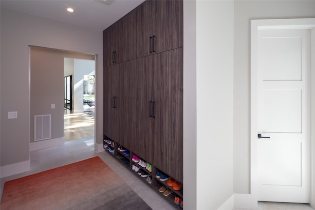 mudroom with light tile patterned floors, recessed lighting, and visible vents