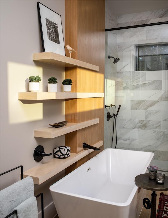 bathroom with a freestanding bath and a stall shower