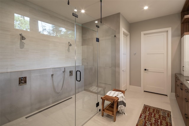 bathroom with vanity, tile patterned flooring, a stall shower, and recessed lighting