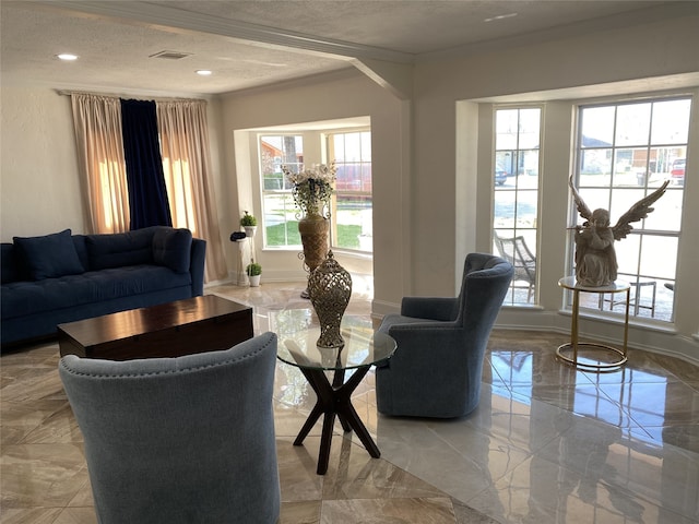 1319 Cherry Spring Dr, Houston, TX 77038 - living room with marble finish floor, baseboards, a healthy amount of sunlight, and a textured ceiling