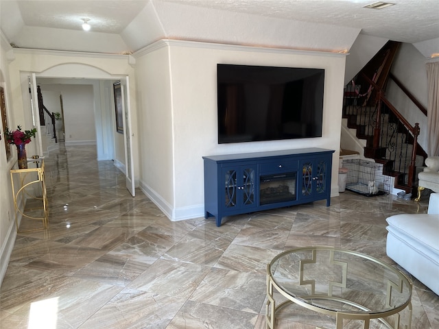 1319 Cherry Spring Dr, Houston, TX 77038 - living area with stairway, a textured ceiling, lofted ceiling, marble finish floor, and baseboards