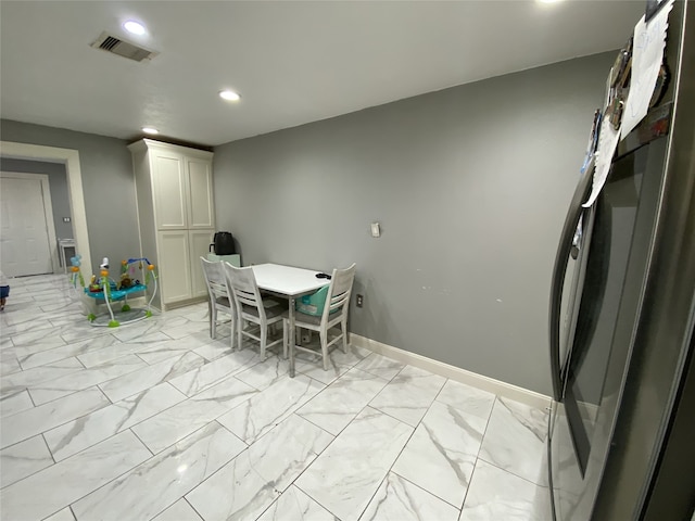 1319 Cherry Spring Dr, Houston, TX 77038 - unfurnished dining area featuring marble finish floor, baseboards, visible vents, and recessed lighting