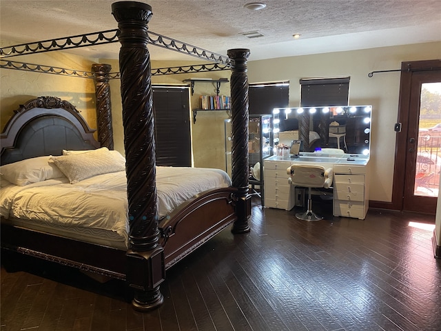 1319 Cherry Spring Dr, Houston, TX 77038 - bedroom featuring access to outside, multiple windows, hardwood / wood-style flooring, and a textured ceiling