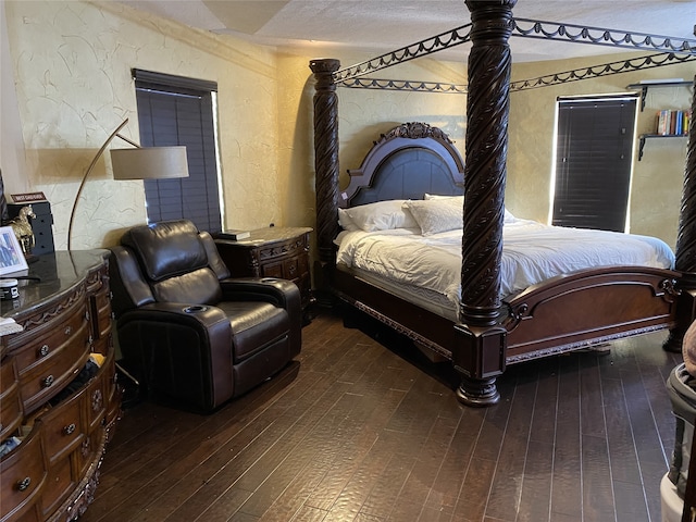 1319 Cherry Spring Dr, Houston, TX 77038 - bedroom with dark wood-style flooring and a textured wall