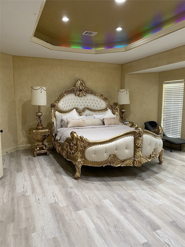 1319 Cherry Spring Dr, Houston, TX 77038 - bedroom featuring a tray ceiling, visible vents, wood finished floors, and recessed lighting
