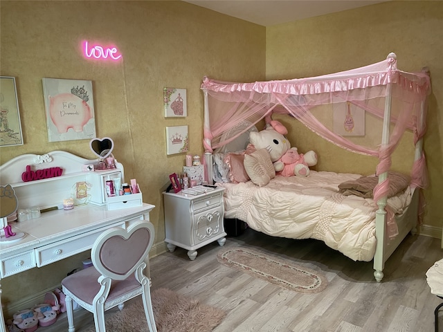 1319 Cherry Spring Dr, Houston, TX 77038 - bedroom featuring baseboards and wood finished floors