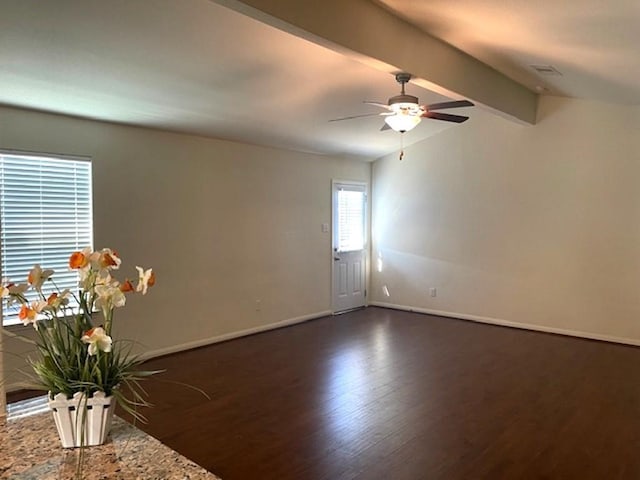 empty room with vaulted ceiling with beams, baseboards, visible vents, ceiling fan, and dark wood-style flooring