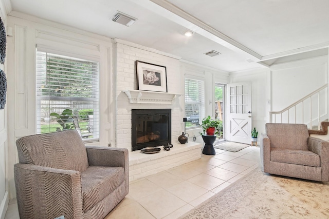 5306 Havenwoods Dr, Houston, TX 77066 - tiled living area with a brick fireplace, crown molding, and stairs