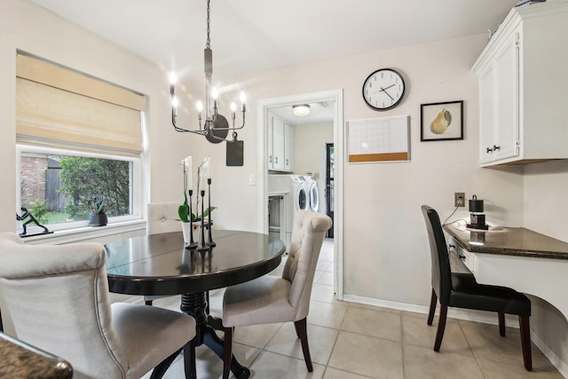 5306 Havenwoods Dr, Houston, TX 77066 - dining area featuring washing machine and clothes dryer, a chandelier, light tile patterned floors, and baseboards