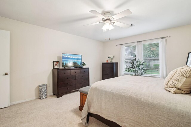 5306 Havenwoods Dr, Houston, TX 77066 - bedroom with light carpet, a ceiling fan, and baseboards