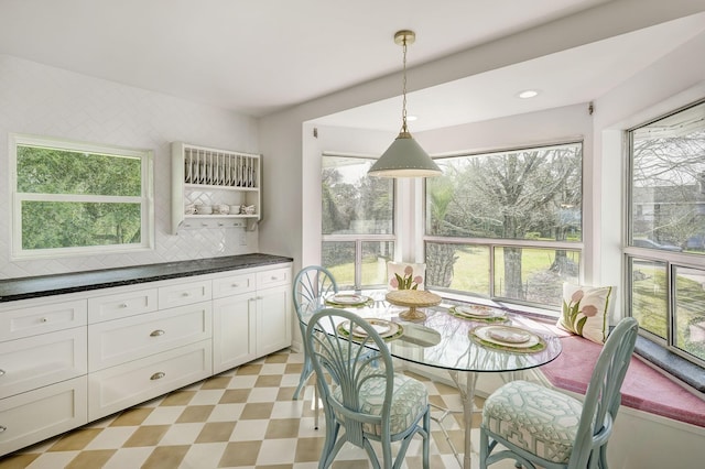 dining space with plenty of natural light, light floors, and recessed lighting