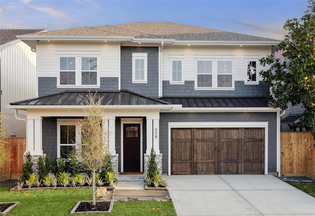 608 E 25th St, Houston, TX 77008 - view of front of house featuring a standing seam roof, an attached garage, driveway, and roof with shingles