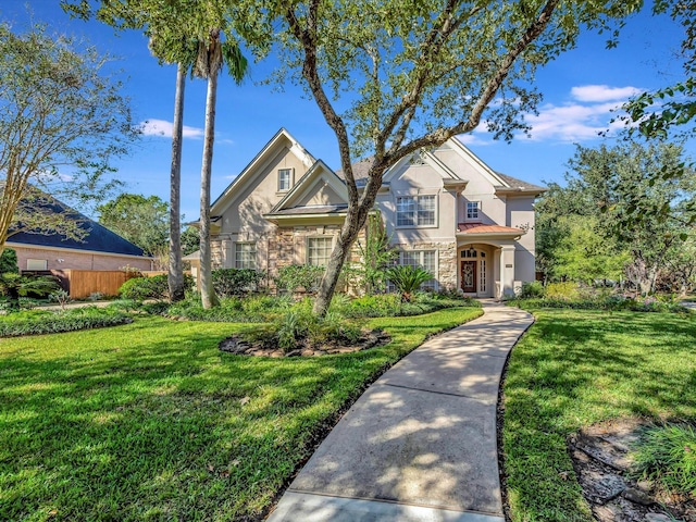 15415 Parkwood Way, Houston, TX 77059 - view of front of property featuring stucco siding, stone siding, fence, and a front lawn