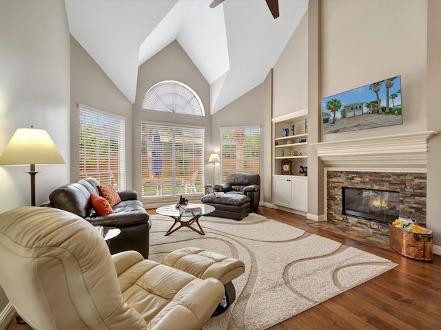 15415 Parkwood Way, Houston, TX 77059 - living area with high vaulted ceiling, built in shelves, ceiling fan, and wood finished floors