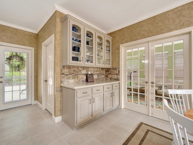15415 Parkwood Way, Houston, TX 77059 - bar featuring light tile patterned floors, french doors, and ornamental molding