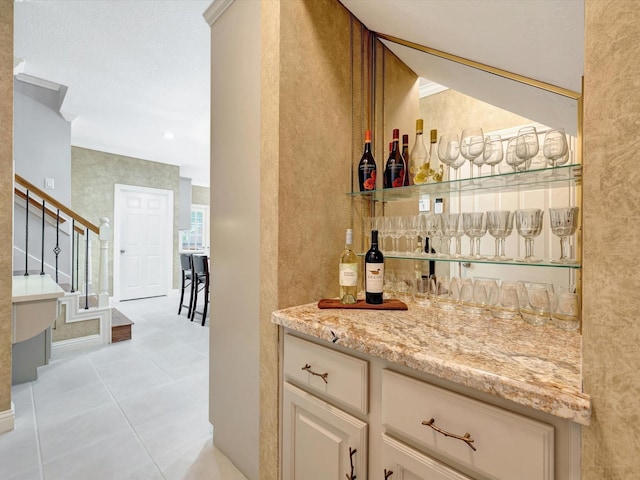 15415 Parkwood Way, Houston, TX 77059 - bar featuring a bar, stairs, and light tile patterned floors