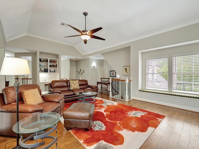 15415 Parkwood Way, Houston, TX 77059 - living area with visible vents, built in shelves, a ceiling fan, wood finished floors, and vaulted ceiling