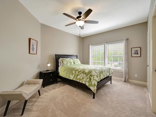 15415 Parkwood Way, Houston, TX 77059 - bedroom featuring ceiling fan, light colored carpet, and baseboards
