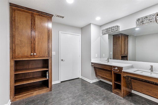 18510 Bluffview Dr, Crosby, TX 77532 - bathroom featuring visible vents, a sink, baseboards, and two vanities